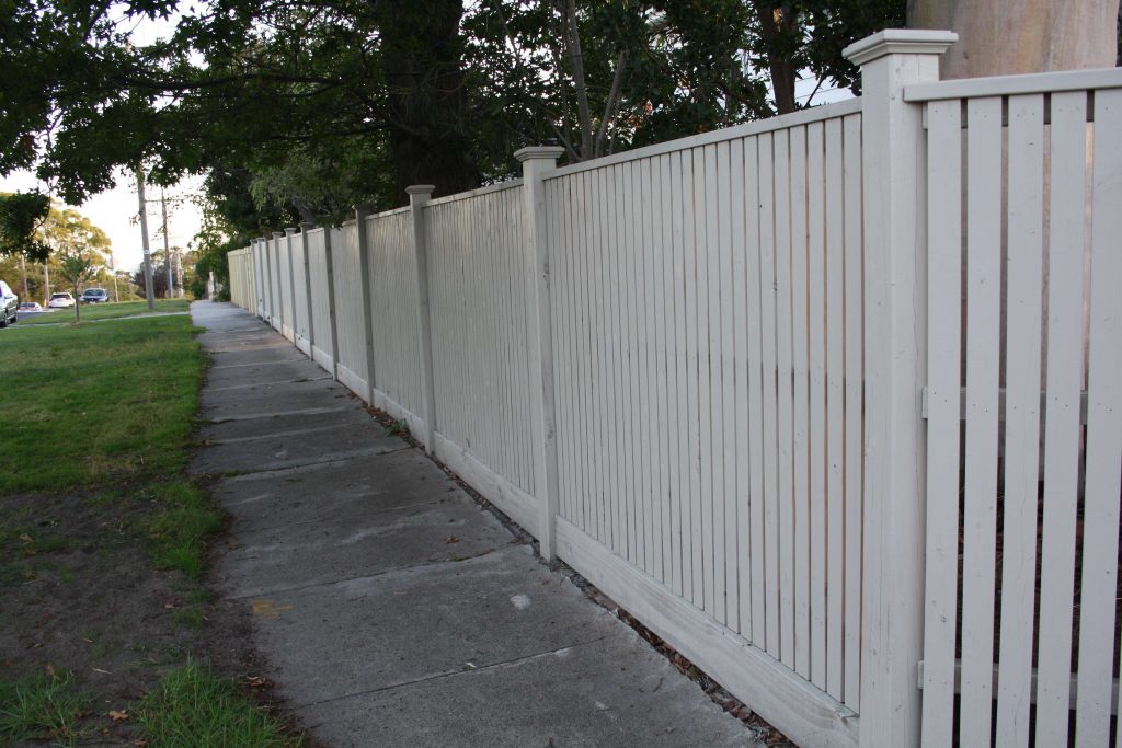 Feature Picket fence with Exposed Posts and Post caps and Gabled Lipped Capping